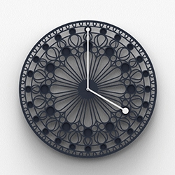Rosone, a large wall clock with cuts and inlays, designed to create a strong visual impact. A tribute to the rose windows of Gothic cathedrals. By Eloisa Libera.