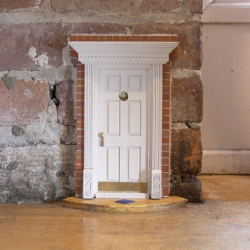 Fairy doors!  Little entrances hidden in the architecture to encourage our mysterious friends to visit.  Check out the "our house" link for a crazy fireplace one.  