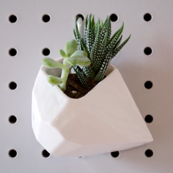 The Rock Planter is digitally modeled using a custom algorithm to generate its' faceted shape then 3D printed in ceramic.