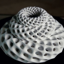 John Edmark's 3D printed Fibonacci Zoetrope Sculptures are designed to animate when spun under a strobe light. The rotation speed is synchronized to the strobe so that one flash occurs every time the sculpture turns 137.5º—the golden angle. 