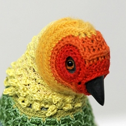 Laurel Roth presents an ongoing collection of carved and crocheted-yarn-clothed birds by the name of "Biodiversity Reclamation Suits for Urban Pigeons." - Some very fancy feathered friends here. Very fancy.