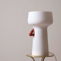 Love the Bird is a table-top lamp that has a sex toy stowed on its side: the bird. By Marc Dibeh.