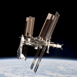 Taken by Italian astronaut Paolo Nespoli as he left the International Space Station in May, the picture is the first-ever image of an American orbiter docked to the ISS.
