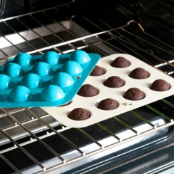As the cake pop trend continues to spread (and get more commercialized) Nordic Ware now has a Cake Pop Pan! Instead of crumbling cake and mixing with frosting... you can just bake spherical mini cakes!