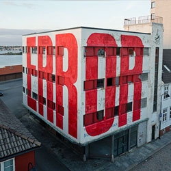 'Error' painted large scale on the facade of a  building in Stavanger, Norway, by urban artist SpY. Nuart Festival 2014.