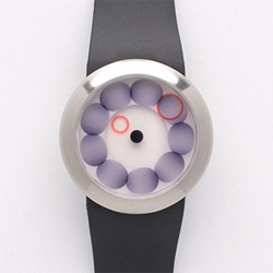 This "platinum" watch from Spring Art & Design is completely intriguing--the movement probably looks great on the wrist. Plus it come in a little zippered pod.