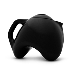 Tripot teapot by Vincent Reardon.  Super cute porclain design and interesting form has a space for a tea warming candle underneath.