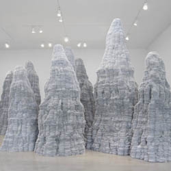 Tara Donovan's newest large-scale sculptures currently at Pace Gallery in NYC are made from millions of index cards and thousands of acrylic rods.
