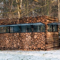 The Tree trunk garden house in Hilversum, Netherlands is an amazing house made from logs. 