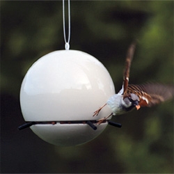 Adorably simple (and slightly deathstar looking) Birdball peanut birdfeeder from Green & Blue - Slipcast in clay. Stainless steel wire. (also in lime and blue)