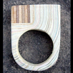 These rings by Ohaly were carved out of an old painting table, taken from a children’s furniture carpentry. It takes 4 month of daily painting to reach this thickness, creating a new material to work with.