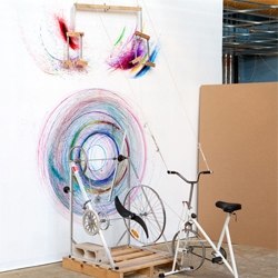Drawing machine #1 is a mixed media installation by artist Joseph l Griffiths. The project consists of a stationary bike, which when pedaled by a user becomes a tool for drawing on a canvas.