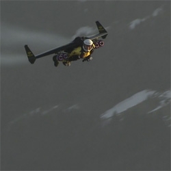 Jetman (Yves Rossy) soars above the Swiss Alps.