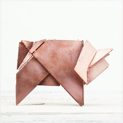 'Schweini die Origamisau', is a copper plate that folds into an origami pig from STRALA.