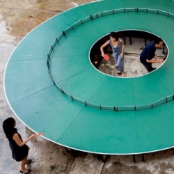 Ping Pong Go-Around, a circular ping pong table by Lee Wen.