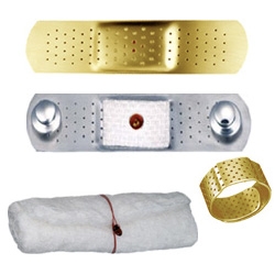 Bandages for the Heart ~ in gold and silver, these  bandage pins are in gold and silver with a red garnet blood droplet... come wrapped in gauze, and come in wedding ring form (perfect for paper cuts?)