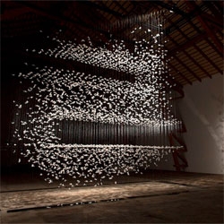 Incredible installations by Isa Barbier composed of suspended feathers.