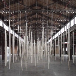 250 prepared ac-motors, 325 kg roof laths, 1.8 km rope, an installation from Zimoun at the Knockdown Center NYC.
