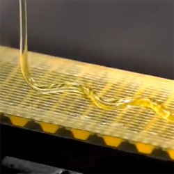 More beautiful fluid dynamics. Watch this viscous fluid as it falls in a stream onto a moving belt.