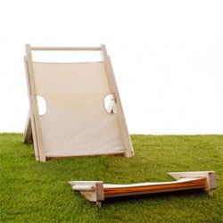 Adrian Wu's 'In'Gage chair for the Seattle Design Festival 2012.The concept is to engage the user with the natural environment by altering the conventional beach chair which makes it look like its embedded into the ground.