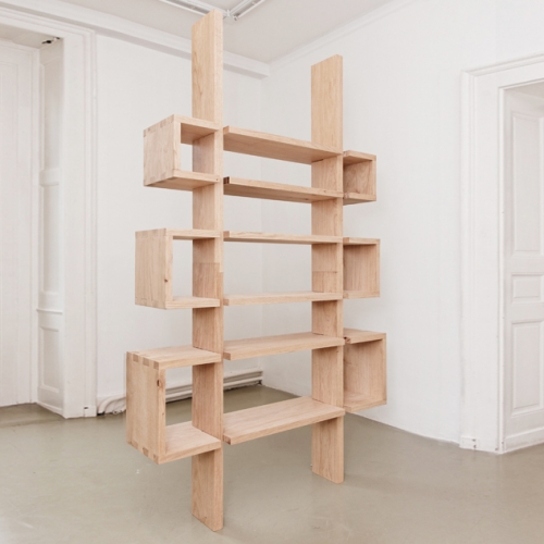 The self-containing bookshelf is a piece of furniture that can fit, when dismantled, inside of its own structure (the upright parts can be dismantled in two and fit in the superior part, the latter fitting in the middle part, the middle part fitting in the lower part).