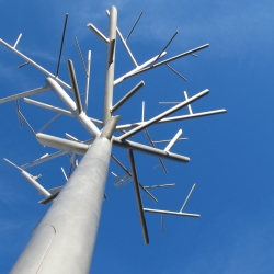 The recycled aluminum trees, "Cité Internationale du Design de Saint Etienne", designed and erected by the French architect and designer Didier Muller, seek to blend furniture so neatly with art.
