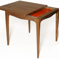 Vestige Table is designed for compact living spaces, the top of the table slides open to reveal a drawer space.
