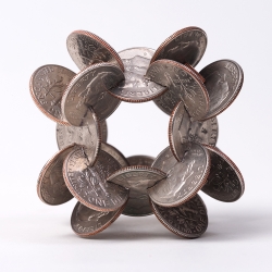 Artist Robert Wechsler was commissioned by The New Yorker to make a series of coin sculptures for this week’s  money-themed issue of the magazine. 