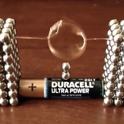 Cute set up of bucky balls, wire, and a battery for a little motor...