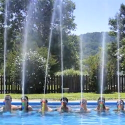 Human Bellagio Fountain - Kids doing a choreographed routine using water guns in a neighborhood pool. 