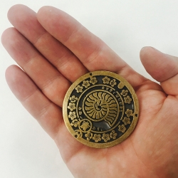 Japanese Manhole Cover Belt Buckle, Nautilus Style from Electric Works. Based on one of the beautiful manhole covers in Japan, these brass belt buckles are weighty and offer superior presence in hand. 