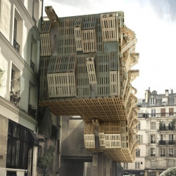 French architect Stephane Malka proposes a fluctuating facade of recycled wooden shipping pallets for a student dormitory in Paris.