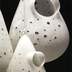 spotted these new birdhouses on inhabitat...do we like them?  im not so sure...
