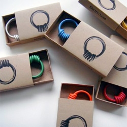 Lovely simple graphical matchbox packaging for these 
Electric Love wire rings by Grain
