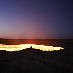 The Darvaza Gas Crater is a burning crater formed from a failed gas drilling attempt that has been burning for the last 35 years in the Karakum Desert in Central Asia.