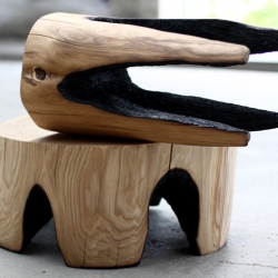 Belgian designer, Kaspar Hamacher creates unique wooden furniture called “ausgebrannt,” which means “burned out” in German. Fire used to burn certain parts of the trunk to form a hole which will then form the legs of the table or stool.