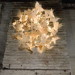 These dramatic spherical chandeliers from Diffuse Lighting are composed of numerous translucent porcelain butterflies each embossed with a delicate damask texture.