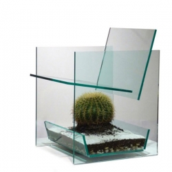 Cactus Chair from Deger Cengiz investigates the effect of visual data to the user's experience. The barrel cactus below causes temporary discomfort, despite the glass between it and the user.