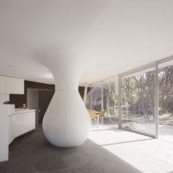 The Cape Schank House in Victoria, AU, has an internal water tank that cools the ambient air temperature of the living room during summer, supplies rain water to the house and garden, and structurally carries the roof load.