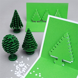 Holiday Pixel Pop Up Cards! Print and cut and fold! Love these lego tree looking cards...