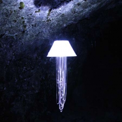 Kristín Birna Bjarnadóttir, has made this lamp, called Illuminant, its made of reflective materials and is hanging down from the ceiling on a fish line..