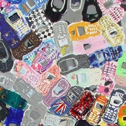 While this looks like an abstract painting of cell phone cases, in fact it's a sheet of recycled plastic made from them.  Used to make great-looking countertops, display cases, etc.