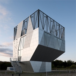 This faceted box is actually a communal center, located in Albertslund, Denmark. It includes the regular: kitchen, auditorium, multipurpose area.. but also a skateboarding ramp and a climbing wall. All in the same box. By Dorte Mandrup Arkitekter.