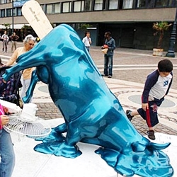 Found on sfgate.com: "Just in case passersby are tempted, the stick of this plastic beefsicle sculpture in Budapest is inscribed with the words 'Don't lick.' " I think it's part of Cow Parade...