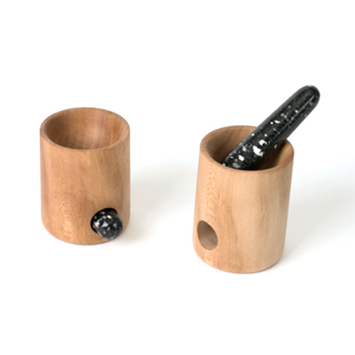 Pat Kim Nest Mortar & Pestle. Inspired by woodpecker nesting holes, the mortar houses the pestle when not in use. Mortar is hand turned American Sycamore, finished with mineral oil and beeswax.  The Pestle is Black Tourmaline, speckled with white quartz. 