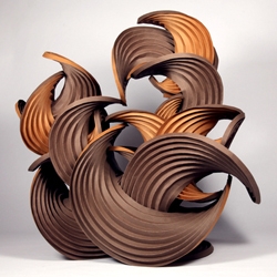 Curved-Crease Paper Sculptures by Erik Demaine and Martin Demaine is a set of experiments into the potentials for what shapes self-folding origami may one day make. 