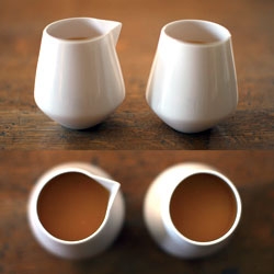 Reiko Kaneko Arctic Jug and Tumbler. A simple, handle-less fine bone china jug. The origami-like spout is in keeping with the clean lines of the piece. 