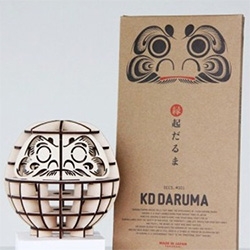 KD Daruma (KD = Knock Down) ~ the classic good luck daruma goes flat packed in laser cut cardboard and plywood versions.