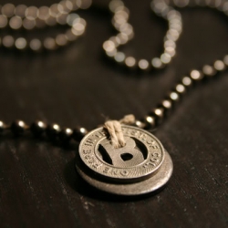 Necklaces made from old transit tokens.