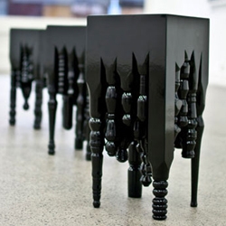 New Zealand-born designer, Jonathon Logan, created the 'de Sade' table as an expression of eroticism in furniture. It's gloss-black form is made from 25 individually hand-turned kauri table legs.